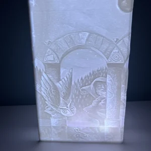 Фронтален изглед на 3D отпечатана литофанова книга 'Хари Потър и Философският камък' със светещ ефект.